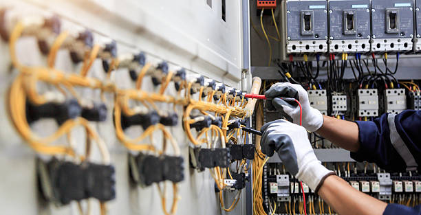 Professional Electrician technician working in Lake Camelot, WI